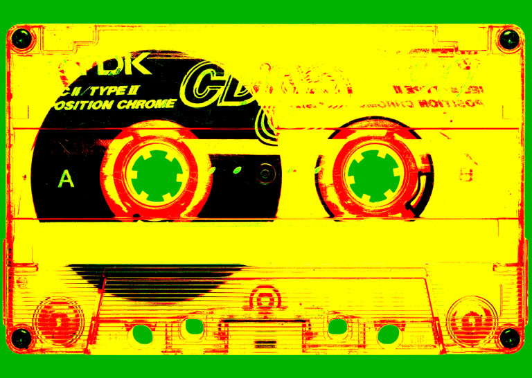 A stylized image of an audio cassette tape with a yellow and red color scheme, set against a green background.